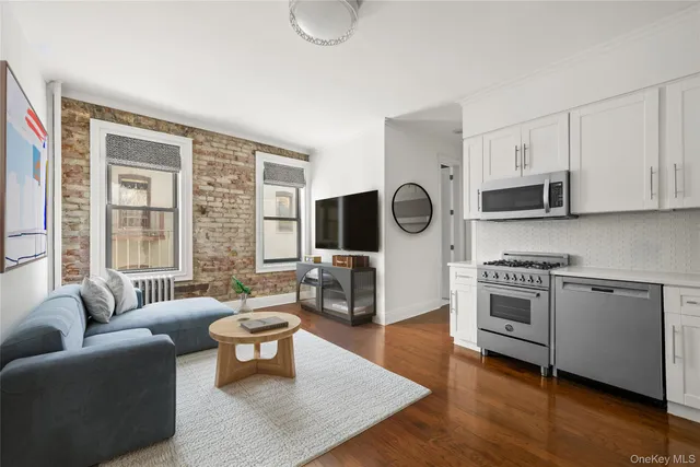 a living room with furniture wooden floor and a fireplace