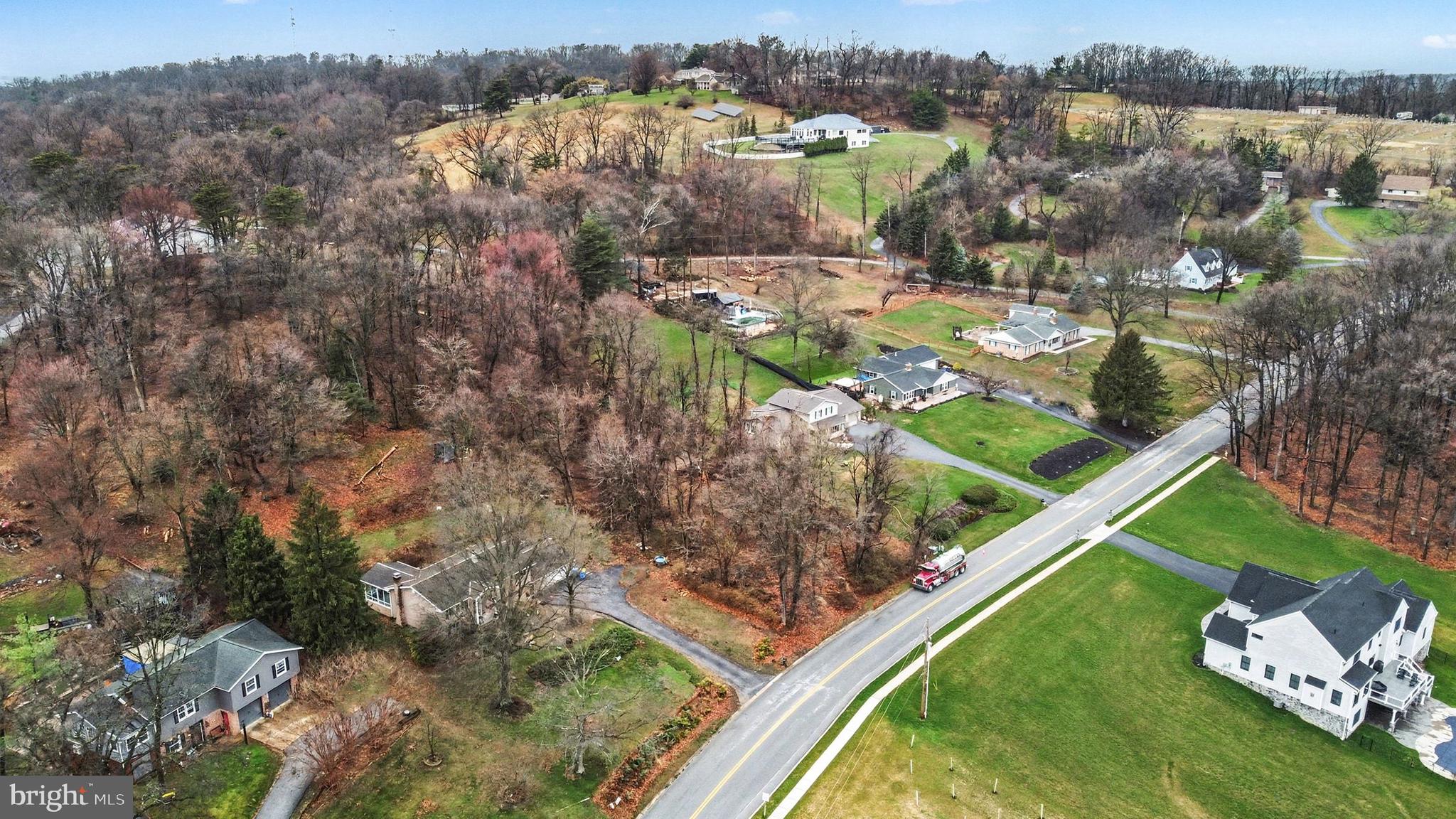 1940 Alcott Road York, PA 17406 - Photo 24 of 31 an aerial view of a house with a garden and lake view