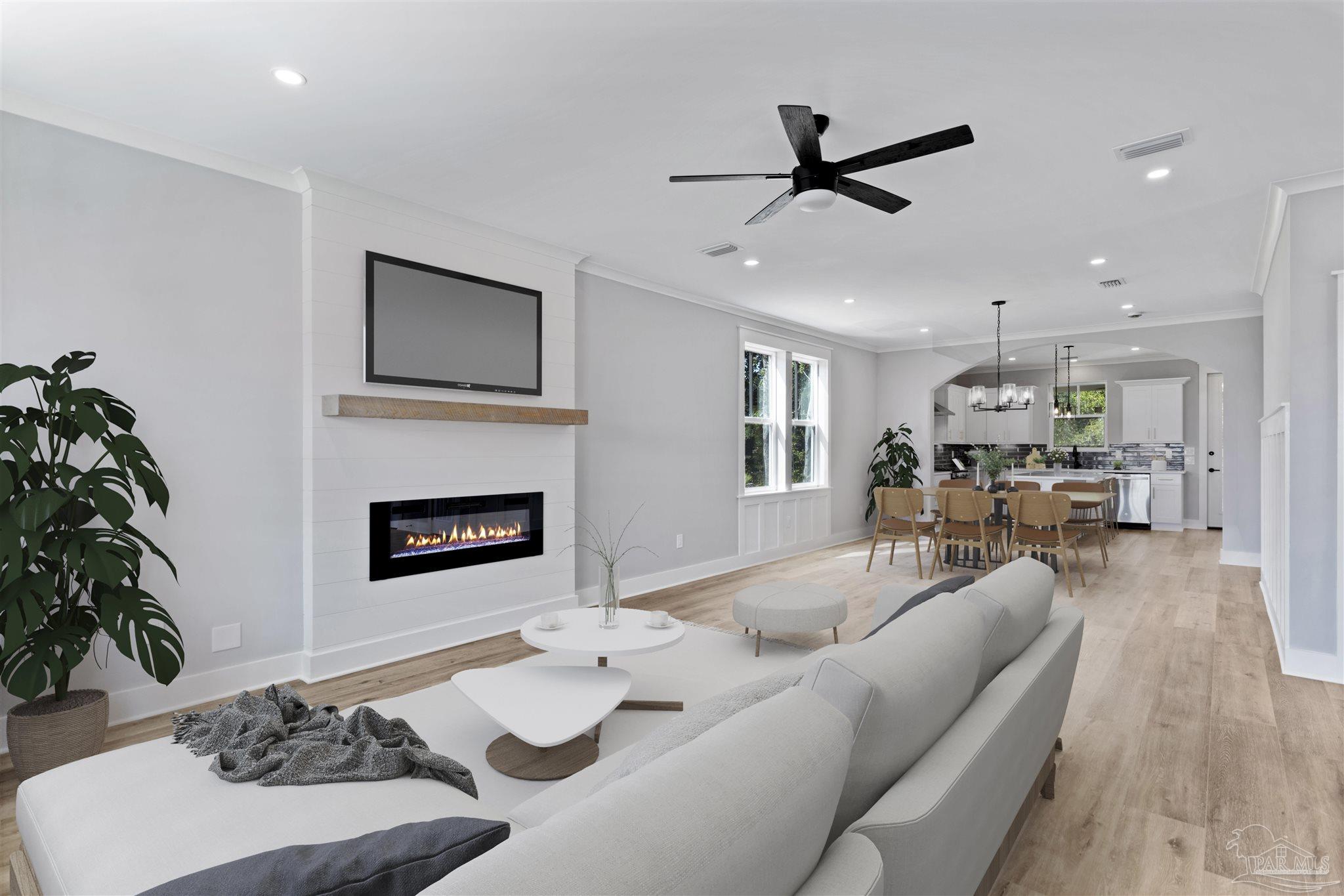 a living room with furniture and a fireplace
