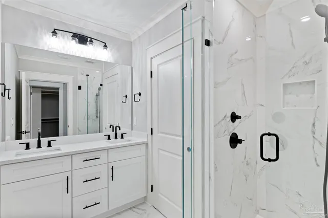 a bathroom with a double vanity sink mirror and double
