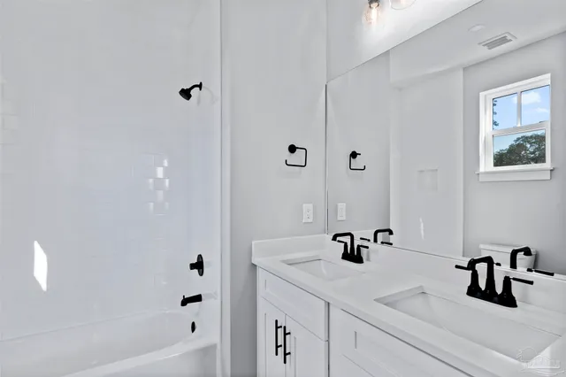 a bathroom with a sink and a tub