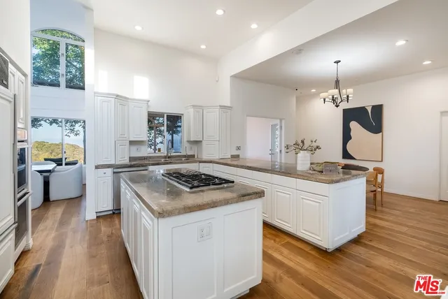 a kitchen with a stove and a sink