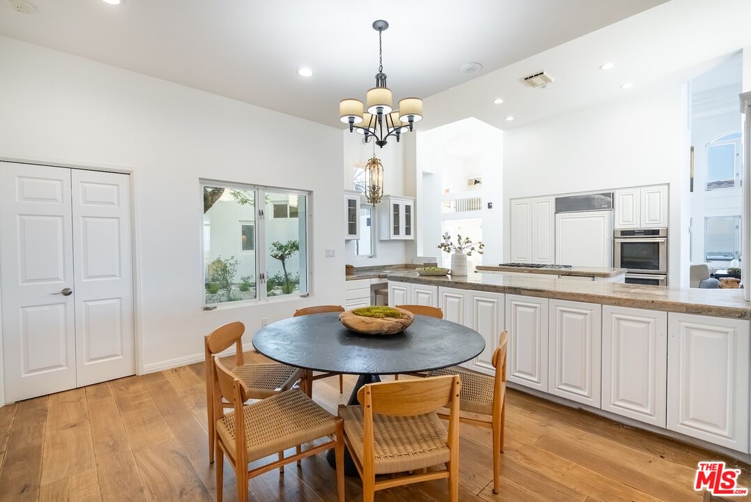 21965 Saddle Peak Road Topanga, CA 90290 - Photo 19 of 56 a dining room with furniture and window