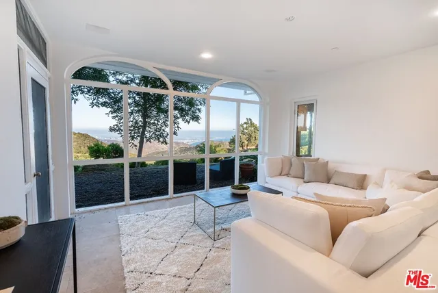 a living room with a couch and a flat screen tv