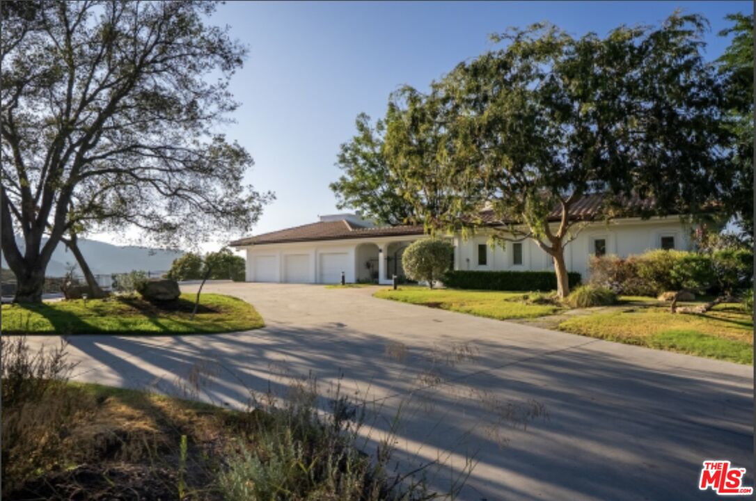 21965 Saddle Peak Road Topanga, CA 90290 - Photo 2 of 56 a view of a house with swimming pool and sitting area