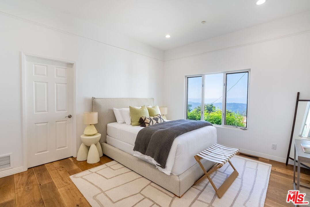 21965 Saddle Peak Road Topanga, CA 90290 - Photo 30 of 56 a bed room with a bed and a window