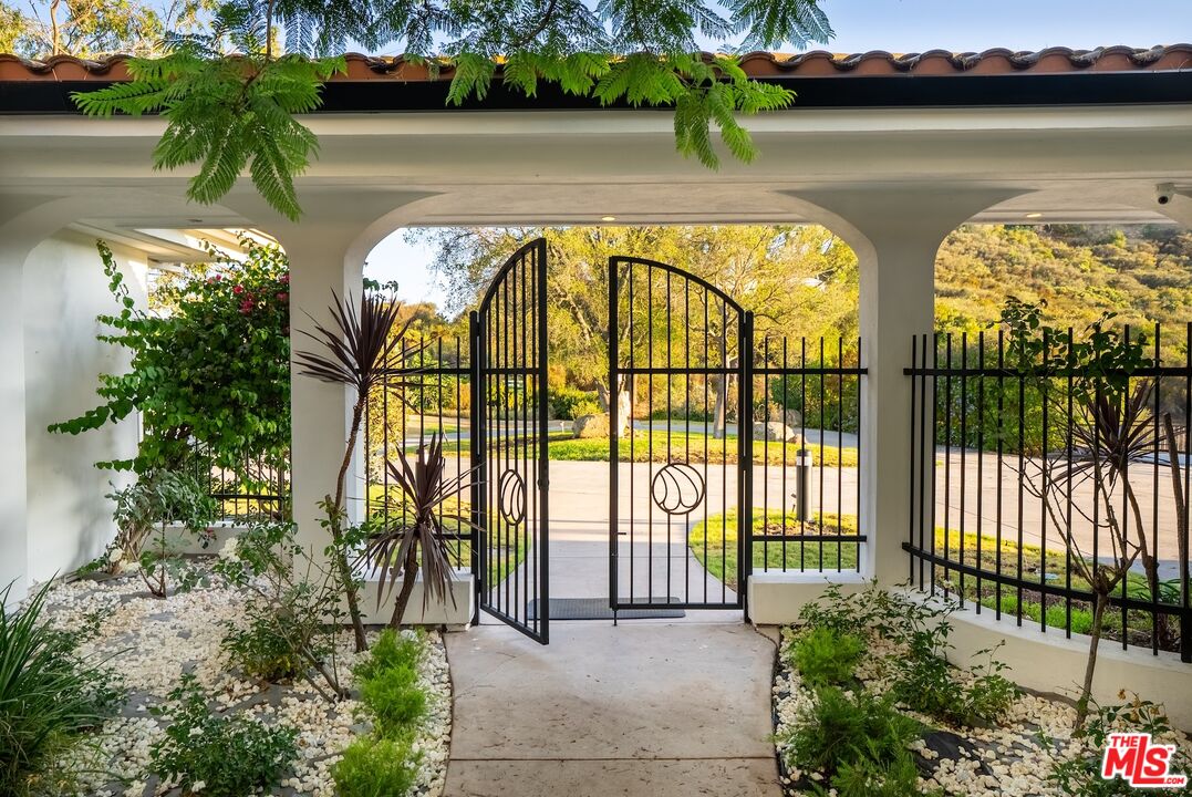21965 Saddle Peak Road Topanga, CA 90290 - Photo 3 of 56 a view of swimming pool with an outdoor seating