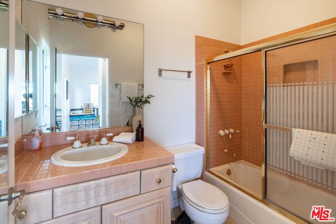 21965 Saddle Peak Road Topanga, CA 90290 - Photo 31 of 56 a bathroom with a sink toilet and shower