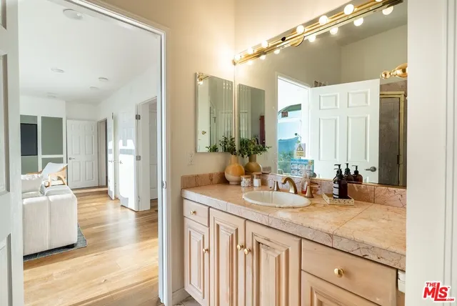 a bathroom with a sink and a mirror