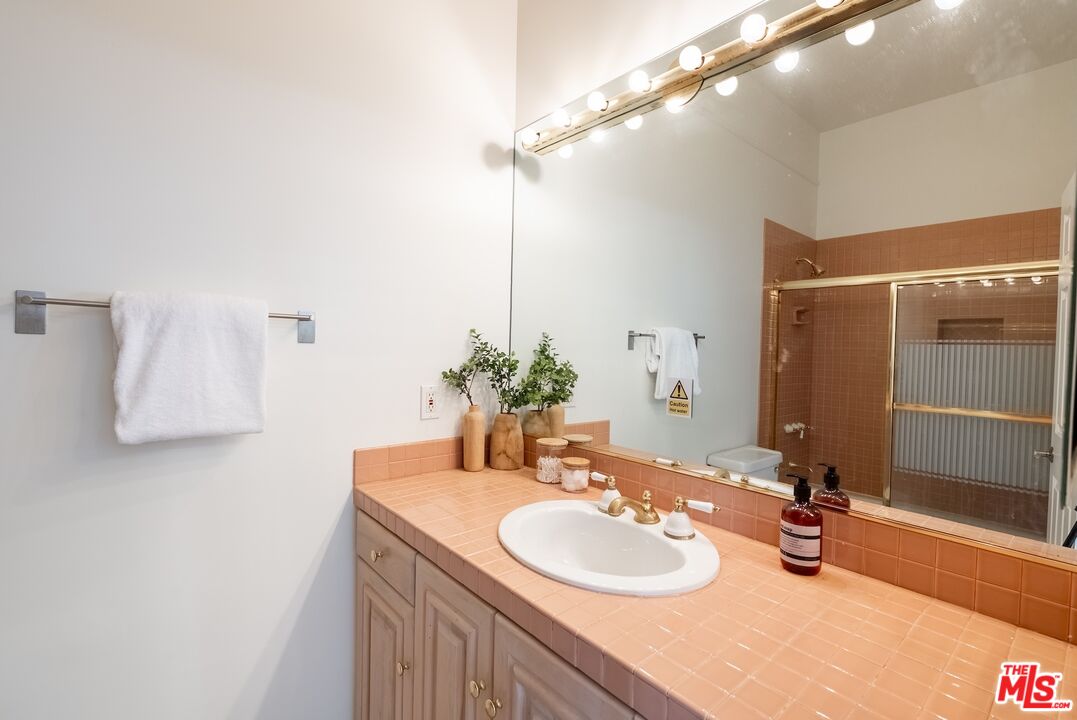 21965 Saddle Peak Road Topanga, CA 90290 - Photo 34 of 56 a bathroom with a sink and a mirror