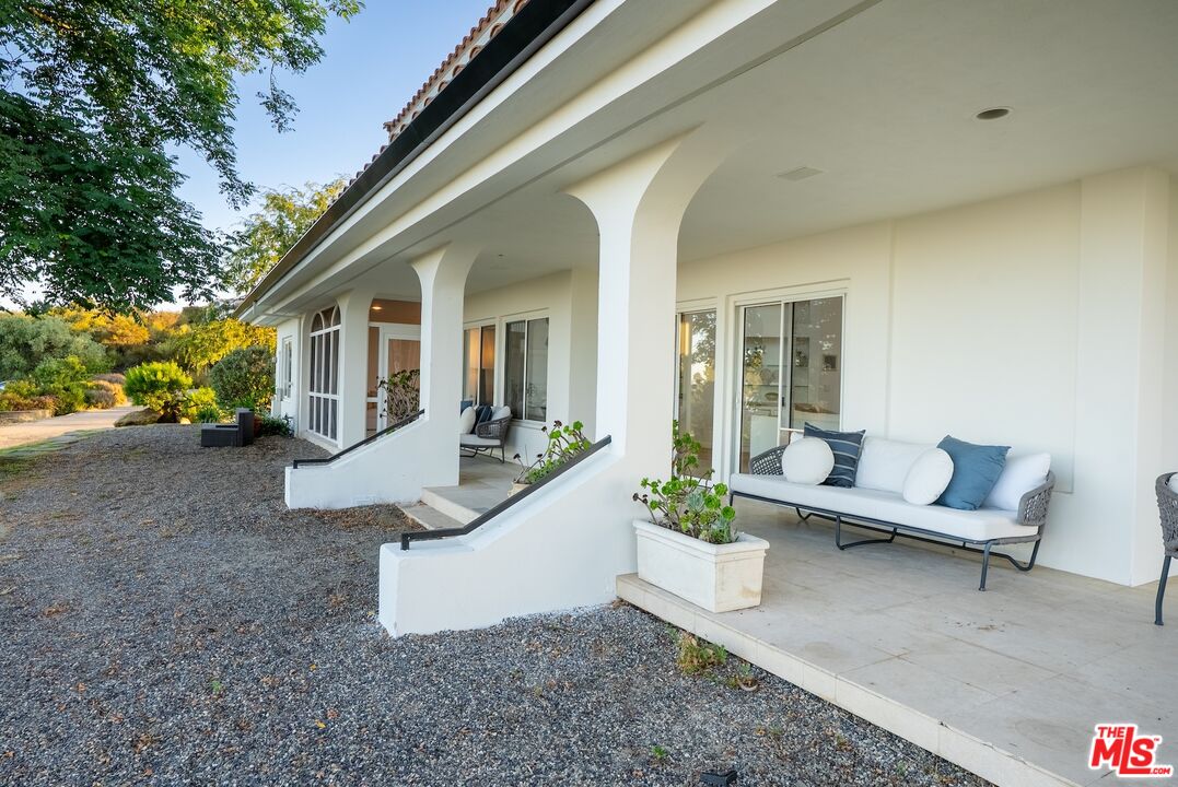 21965 Saddle Peak Road Topanga, CA 90290 - Photo 39 of 56 a view of a house with backyard and sitting area