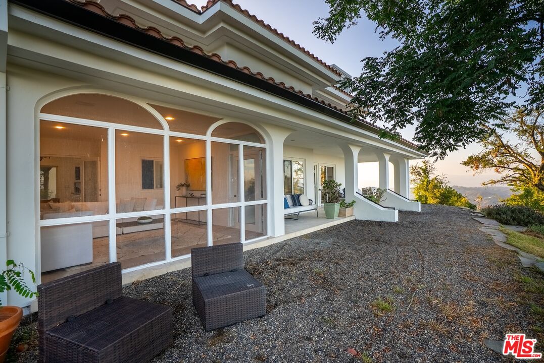 21965 Saddle Peak Road Topanga, CA 90290 - Photo 40 of 56 a view of a house with a porch