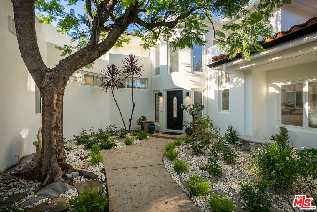 21965 Saddle Peak Road Topanga, CA 90290 - Photo 4 of 56 a view of a house with a yard