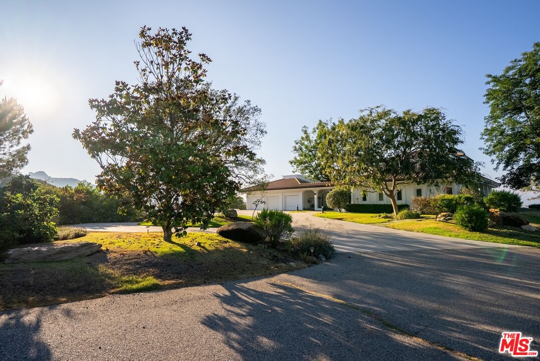 21965 Saddle Peak Road Topanga, CA 90290 - Photo 43 of 56 a view of a swimming pool with an outdoor space and seating area