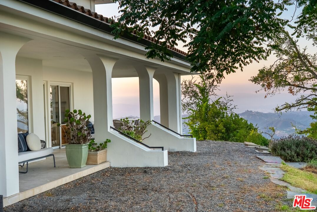 21965 Saddle Peak Road Topanga, CA 90290 - Photo 46 of 56 a view of a house with a yard
