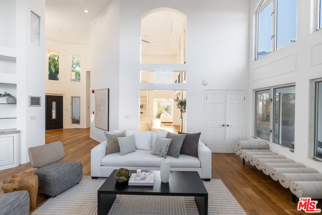 21965 Saddle Peak Road Topanga, CA 90290 - Photo 6 of 56 a living room with furniture and a large window