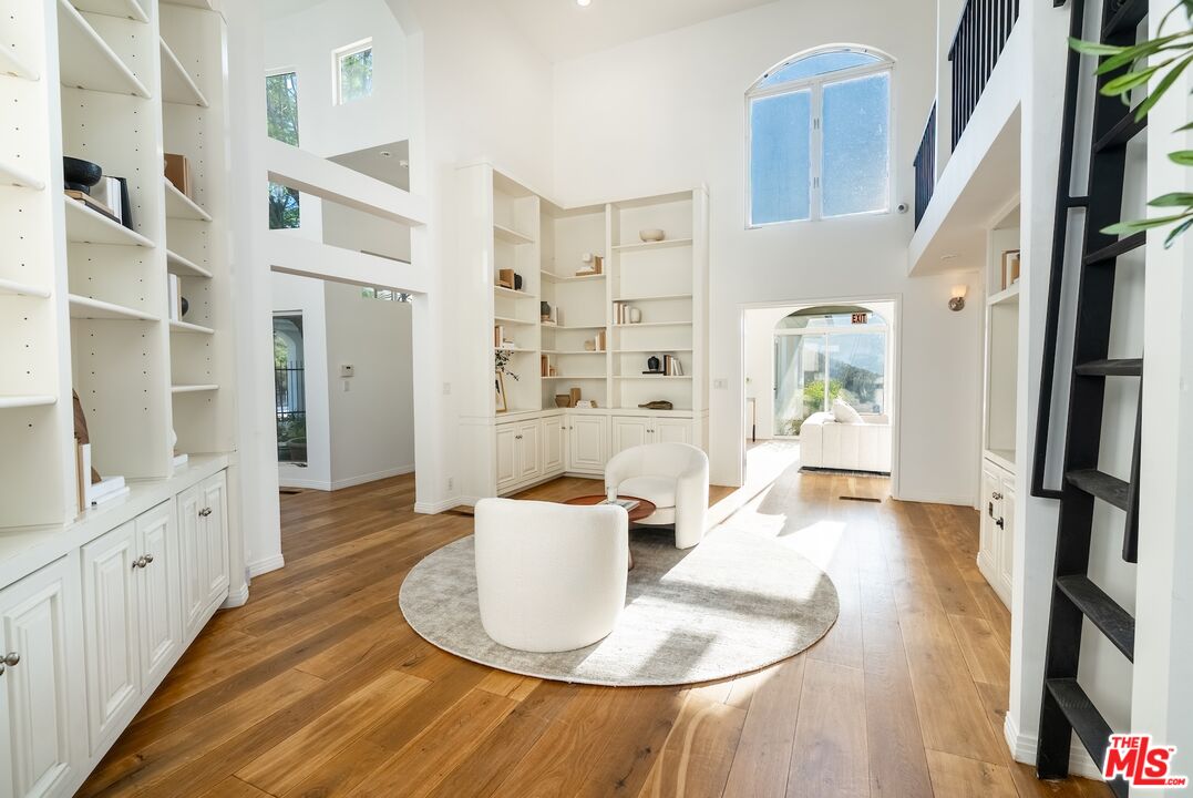 21965 Saddle Peak Road Topanga, CA 90290 - Photo 9 of 56 a dining room with furniture and a floor to ceiling window