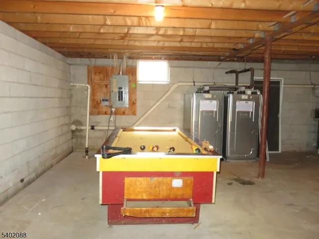 a room with pool table and windows