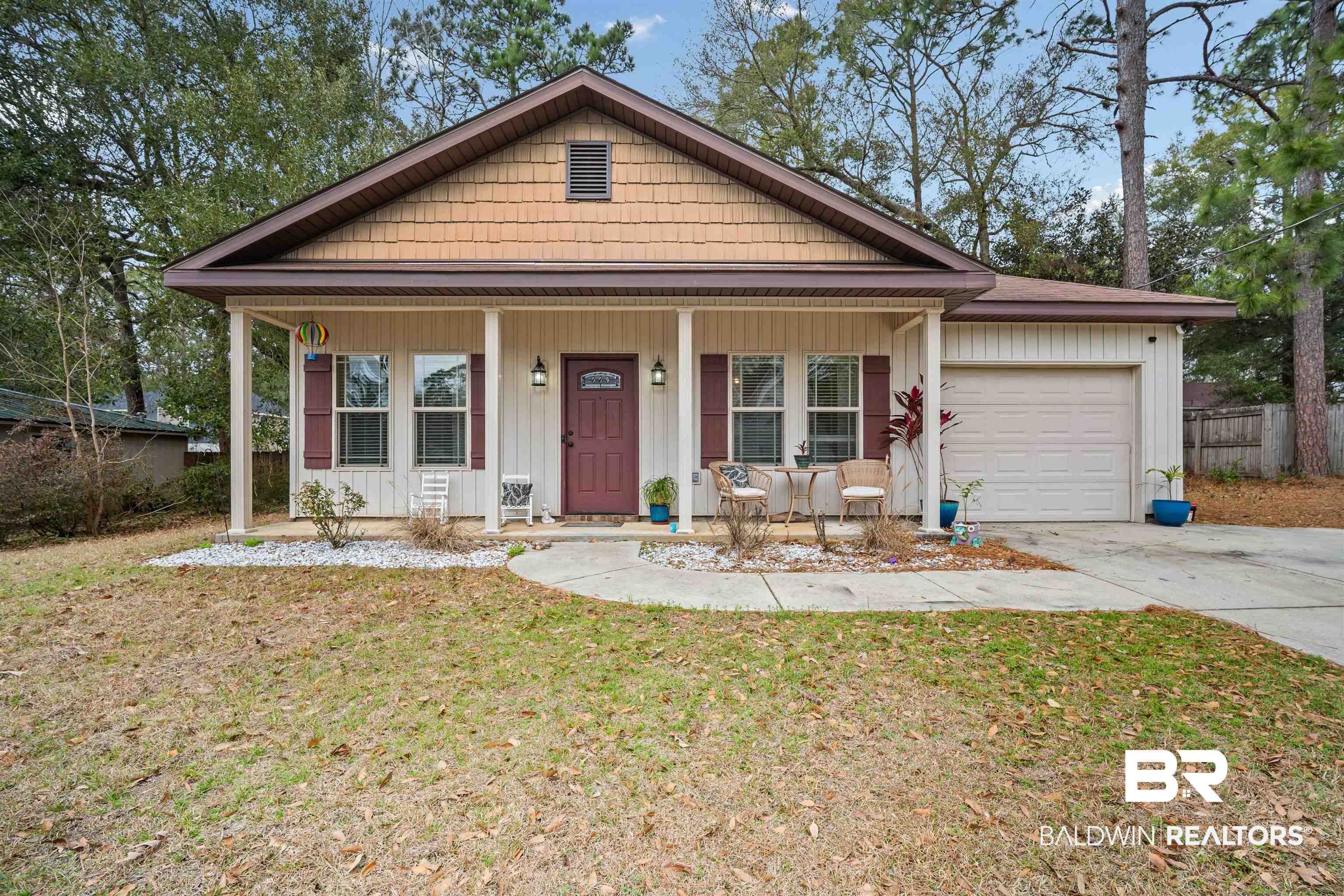 209 Maplewood Loop Daphne, AL 36526 - Photo 1 of 23 View of front of home featuring a porch, board and batten siding, an attached garage, and driveway