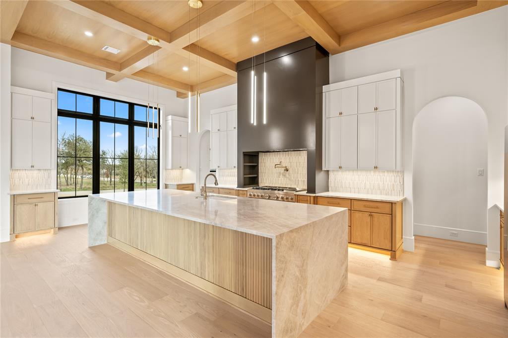 204 Dan Russell Weatherford, TX 76087 - Photo 12 of 40 a large kitchen with kitchen island a large counter top space a sink stainless steel appliances and cabinets
