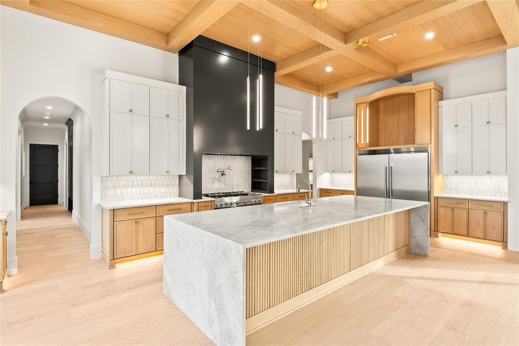 204 Dan Russell Weatherford, TX 76087 - Photo 9 of 40 a large kitchen with kitchen island a sink stainless steel appliances and cabinets