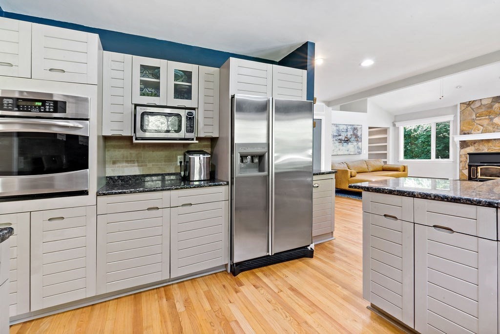 25 Hickory Ridge Road Rehoboth, MA 02769 - Photo 11 of 42 a kitchen with stainless steel appliances granite countertop a refrigerator a stove and a sink