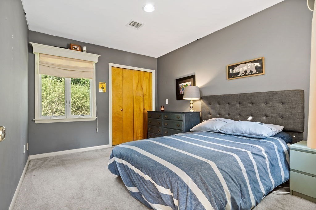 25 Hickory Ridge Road Rehoboth, MA 02769 - Photo 28 of 42 a bedroom with a bed and a window