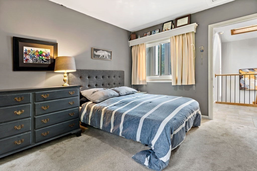 25 Hickory Ridge Road Rehoboth, MA 02769 - Photo 30 of 42 a spacious bedroom with a bed and a window
