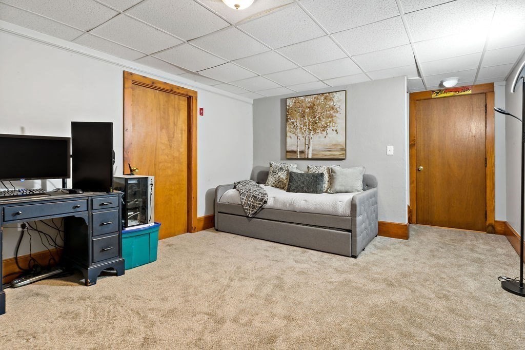 25 Hickory Ridge Road Rehoboth, MA 02769 - Photo 31 of 42 a living room with furniture and a flat screen tv