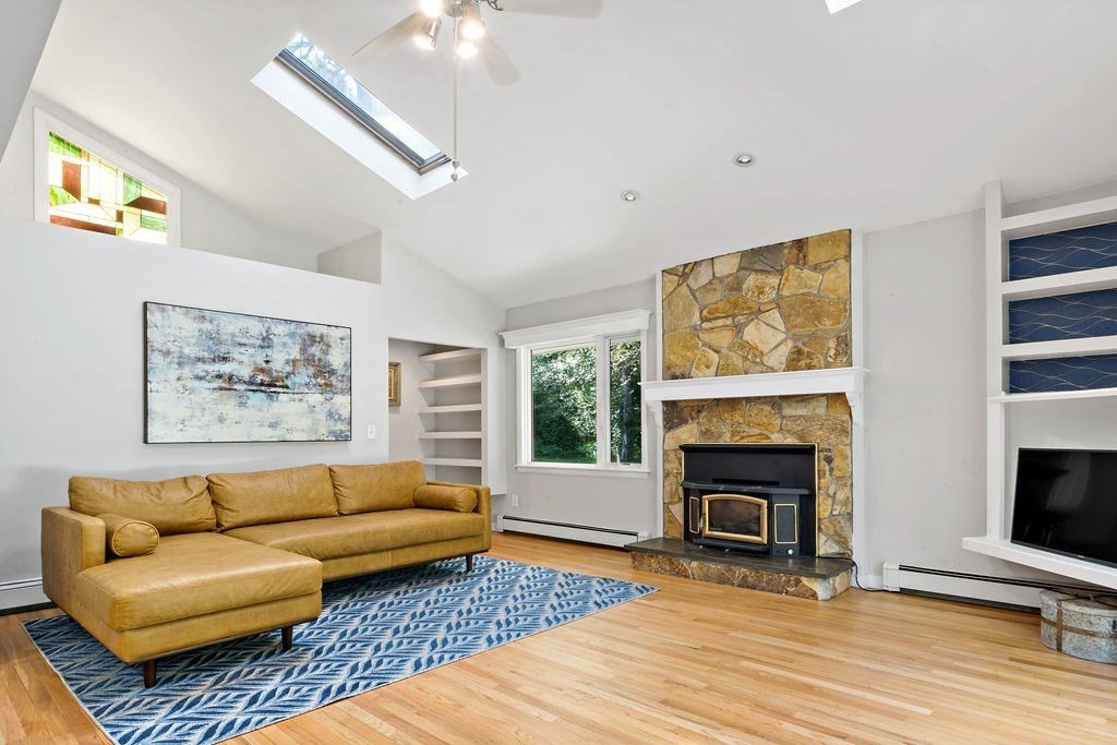 25 Hickory Ridge Road Rehoboth, MA 02769 - Photo 4 of 42 a living room with furniture and a fireplace