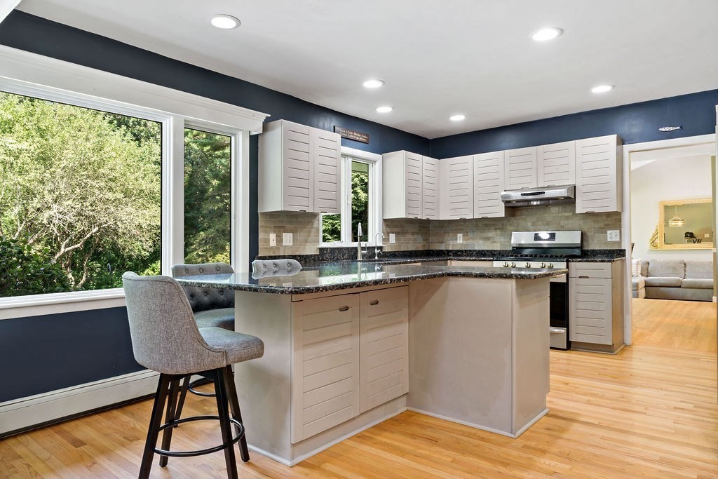 25 Hickory Ridge Road Rehoboth, MA 02769 - Photo 7 of 42 a kitchen with stainless steel appliances granite countertop wooden cabinets and a granite counter tops