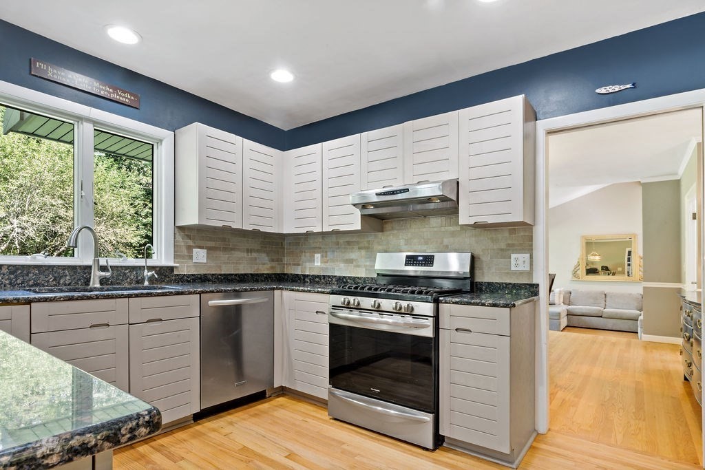 25 Hickory Ridge Road Rehoboth, MA 02769 - Photo 8 of 42 a kitchen with stainless steel appliances granite countertop a stove and a sink