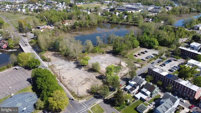 an aerial view of lake residential house with outdoor space and trees