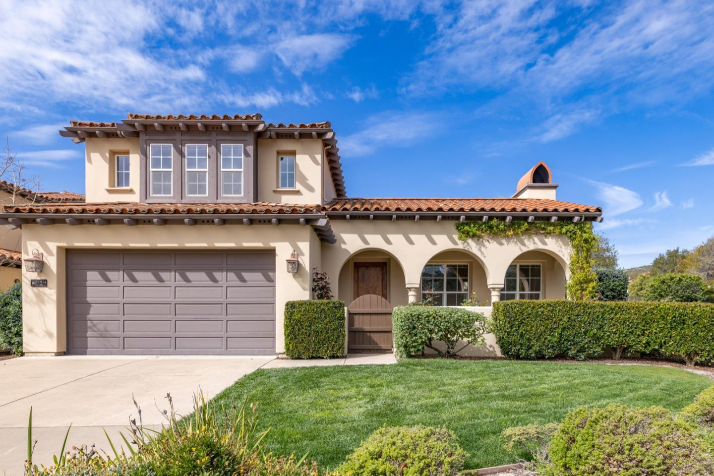 306 Pasadera Drive Monterey, CA 93940 - Photo 1 of 55 a front view of a house with a yard
