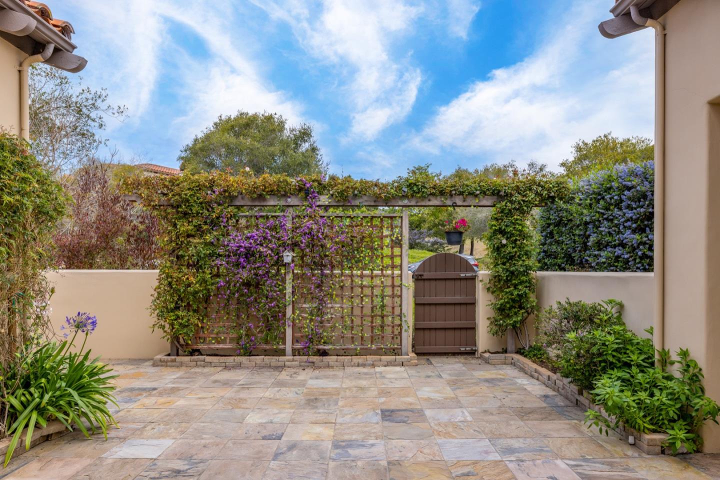 306 Pasadera Drive Monterey, CA 93940 - Photo 12 of 55 a front view of a house with a yard and garage