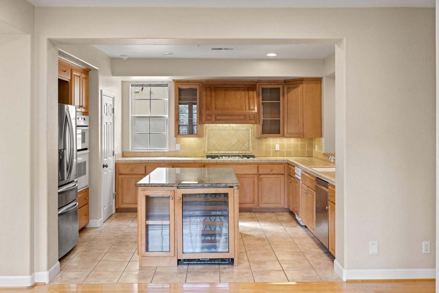 306 Pasadera Drive Monterey, CA 93940 - Photo 17 of 55 a kitchen with stainless steel appliances granite countertop a refrigerator and a sink