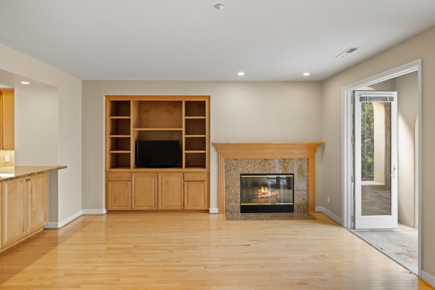 306 Pasadera Drive Monterey, CA 93940 - Photo 27 of 55 a view of an empty room with a fireplace and a window