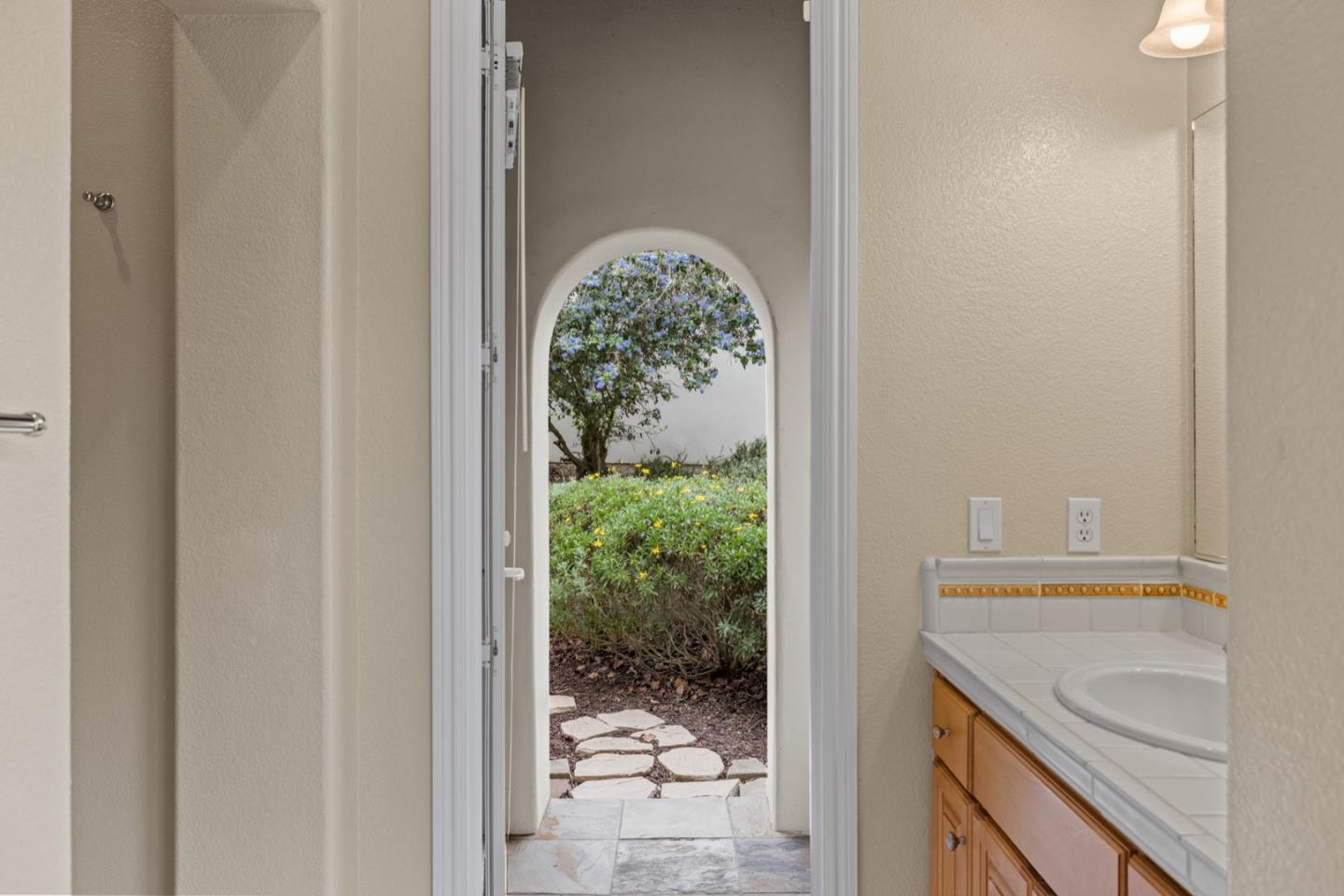 306 Pasadera Drive Monterey, CA 93940 - Photo 37 of 55 a view of a bathroom with a sink and glass door