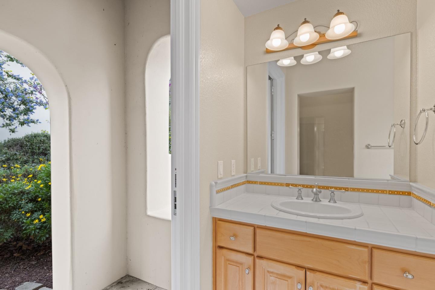 306 Pasadera Drive Monterey, CA 93940 - Photo 38 of 55 a bathroom with a sink vanity and a mirror