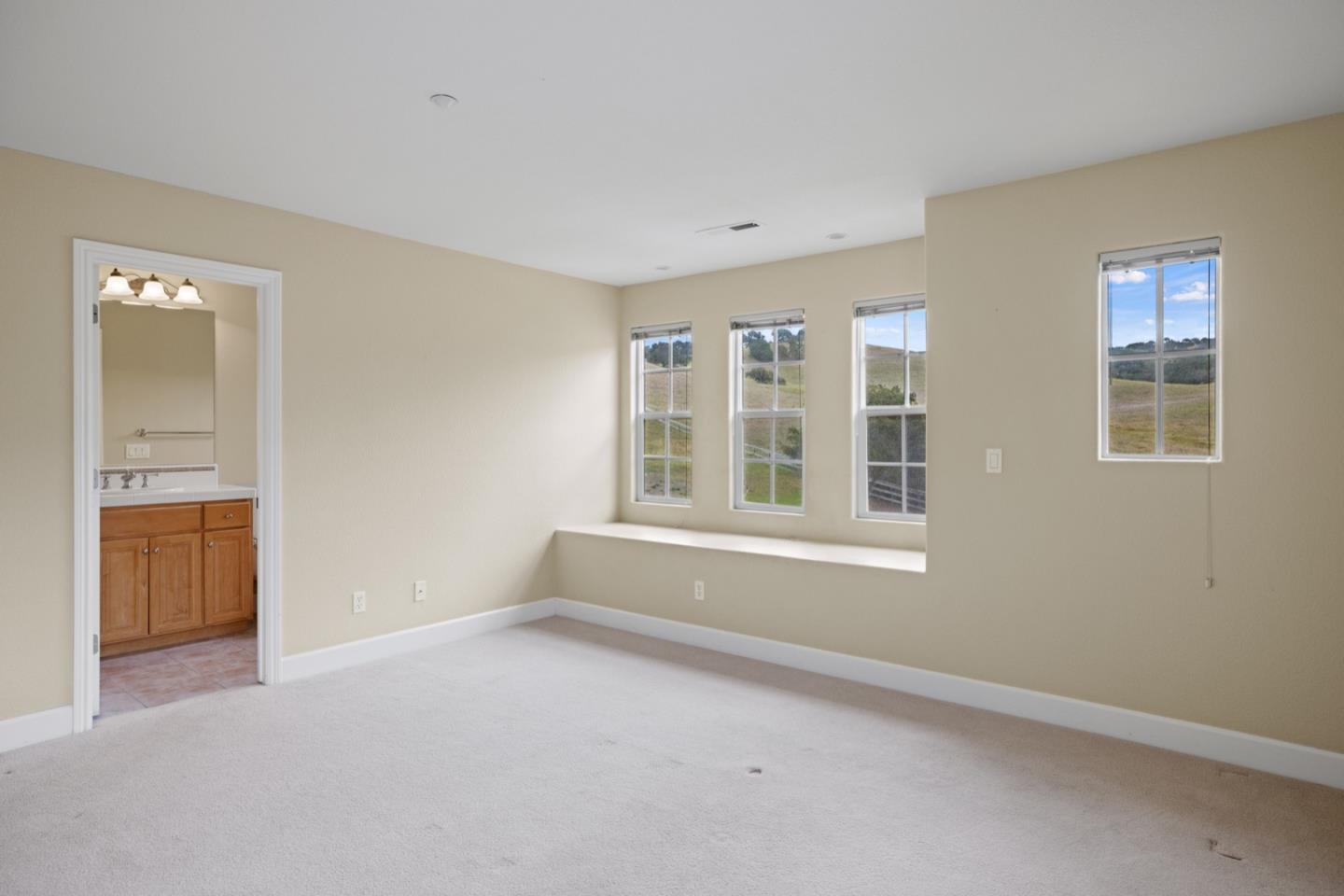 306 Pasadera Drive Monterey, CA 93940 - Photo 44 of 55 an empty room with windows and cabinet