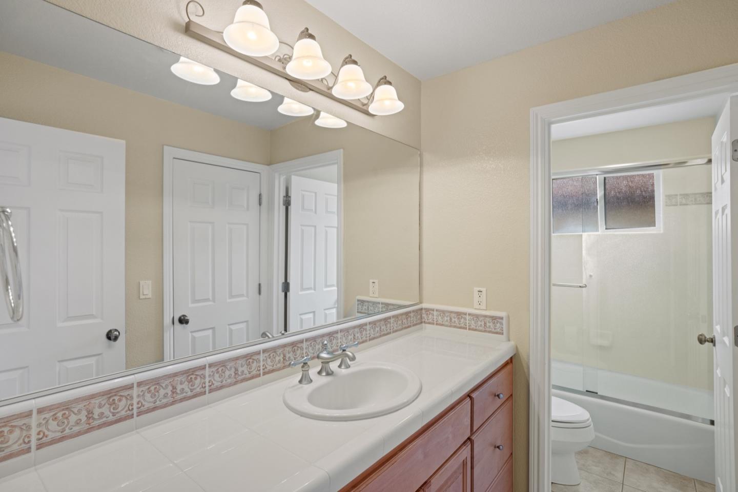 306 Pasadera Drive Monterey, CA 93940 - Photo 48 of 55 a bathroom with a sink a toilet and shower