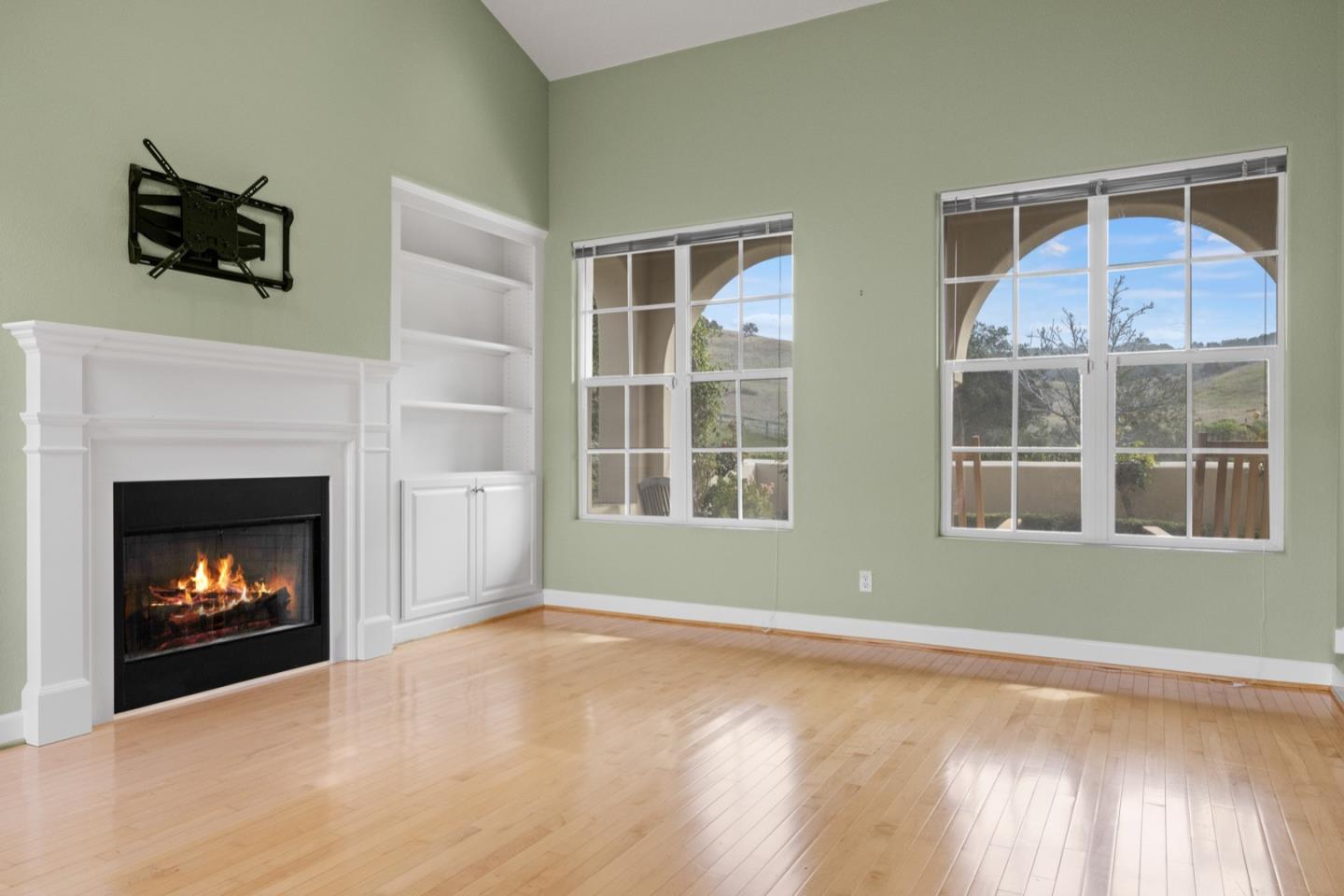 306 Pasadera Drive Monterey, CA 93940 - Photo 5 of 55 a view of an empty room with wooden floor fireplace and a window