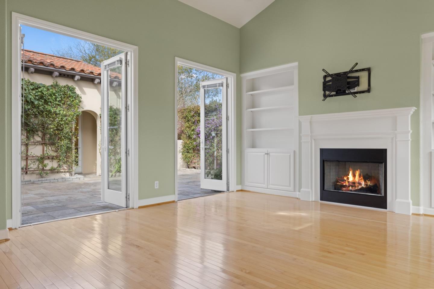 306 Pasadera Drive Monterey, CA 93940 - Photo 7 of 55 a view of an empty room with a fireplace and a window