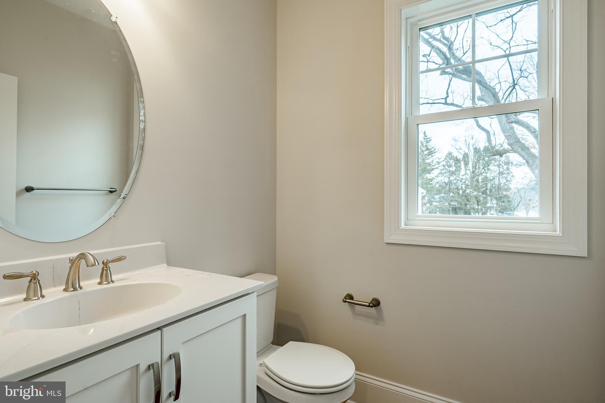 1107 Vilsmeier Road Lansdale, PA 19446 - Photo 11 of 58 a bathroom with a granite countertop sink toilet and a mirror