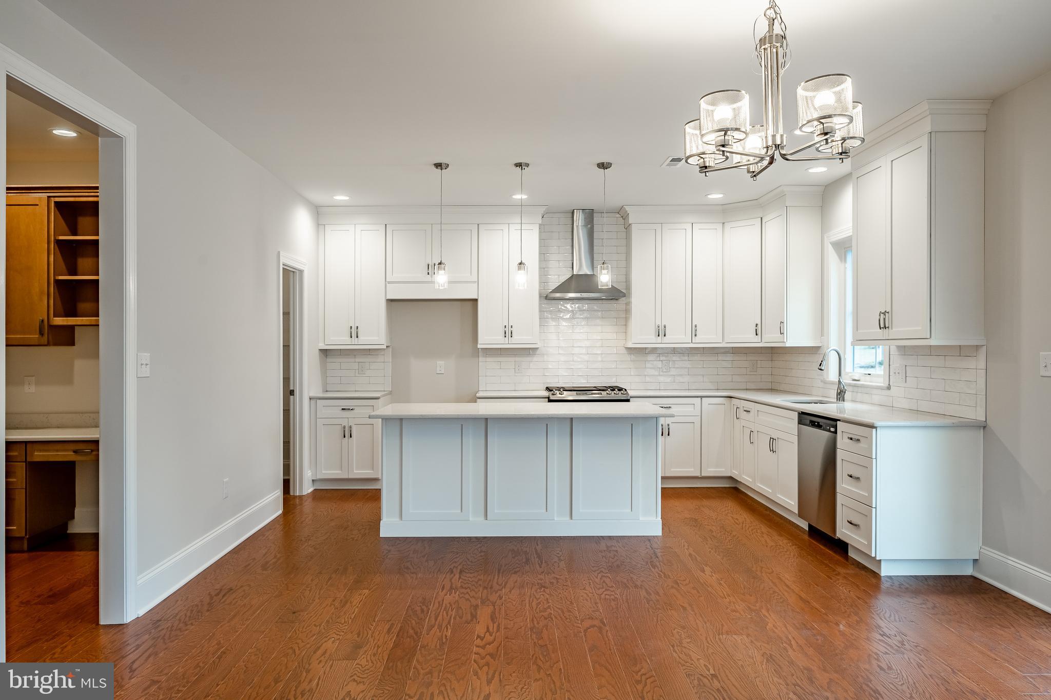 1107 Vilsmeier Road Lansdale, PA 19446 - Photo 14 of 58 a kitchen with kitchen island granite countertop a sink cabinets and stainless steel appliances