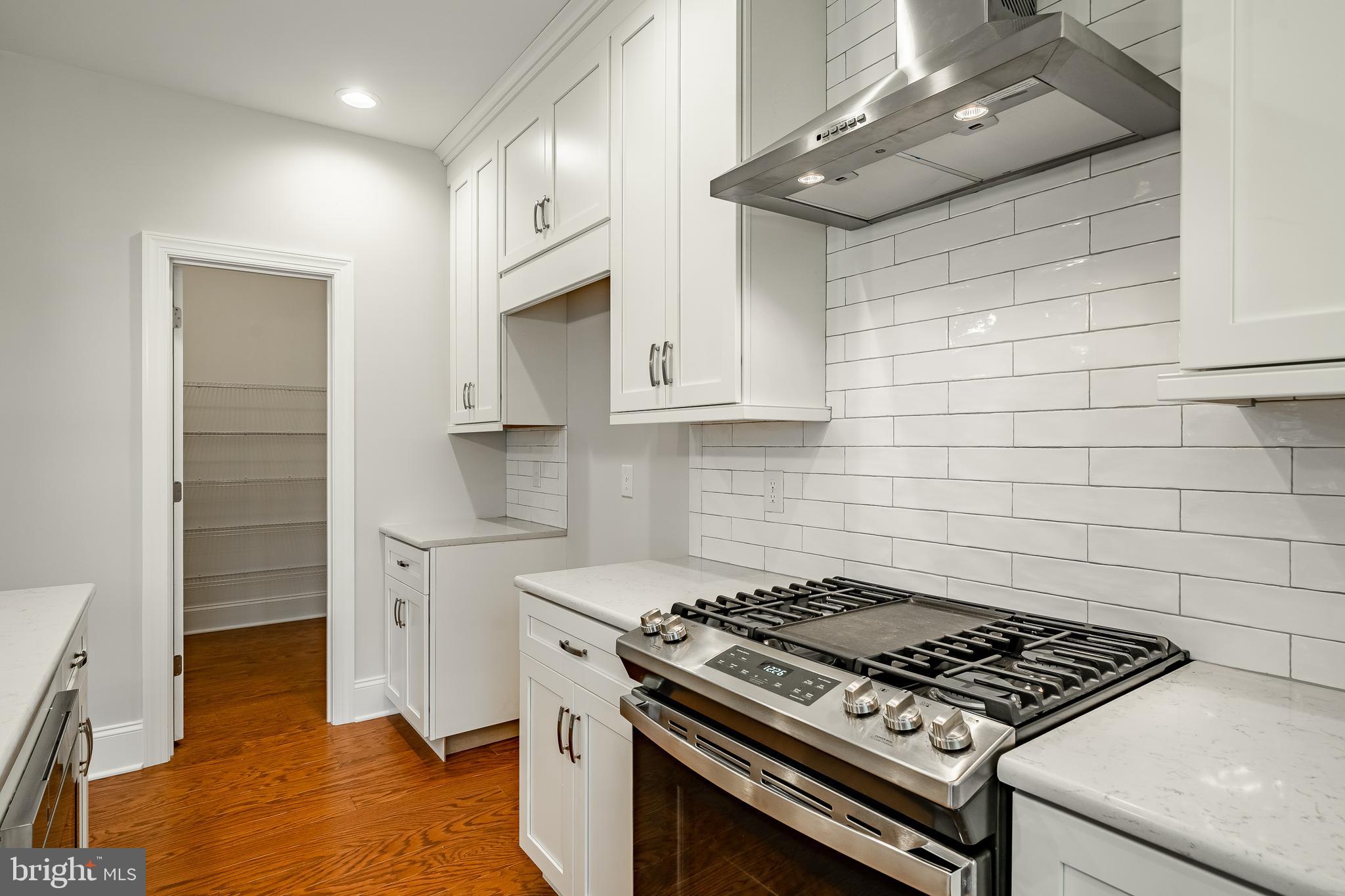 1107 Vilsmeier Road Lansdale, PA 19446 - Photo 21 of 58 a kitchen with stainless steel appliances granite countertop a stove and a refrigerator