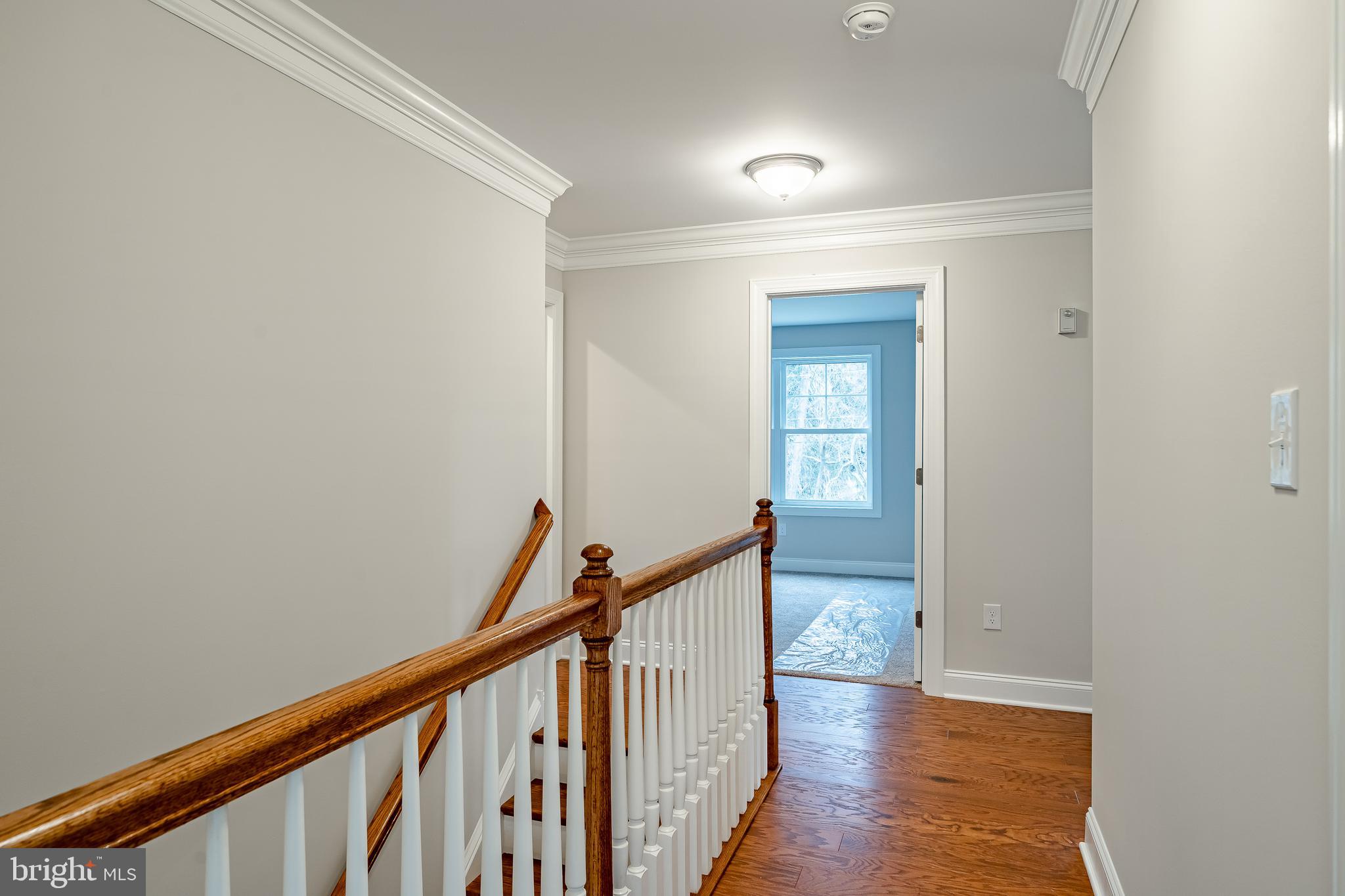1107 Vilsmeier Road Lansdale, PA 19446 - Photo 30 of 58 a view of a hallway with wooden floor and stairs