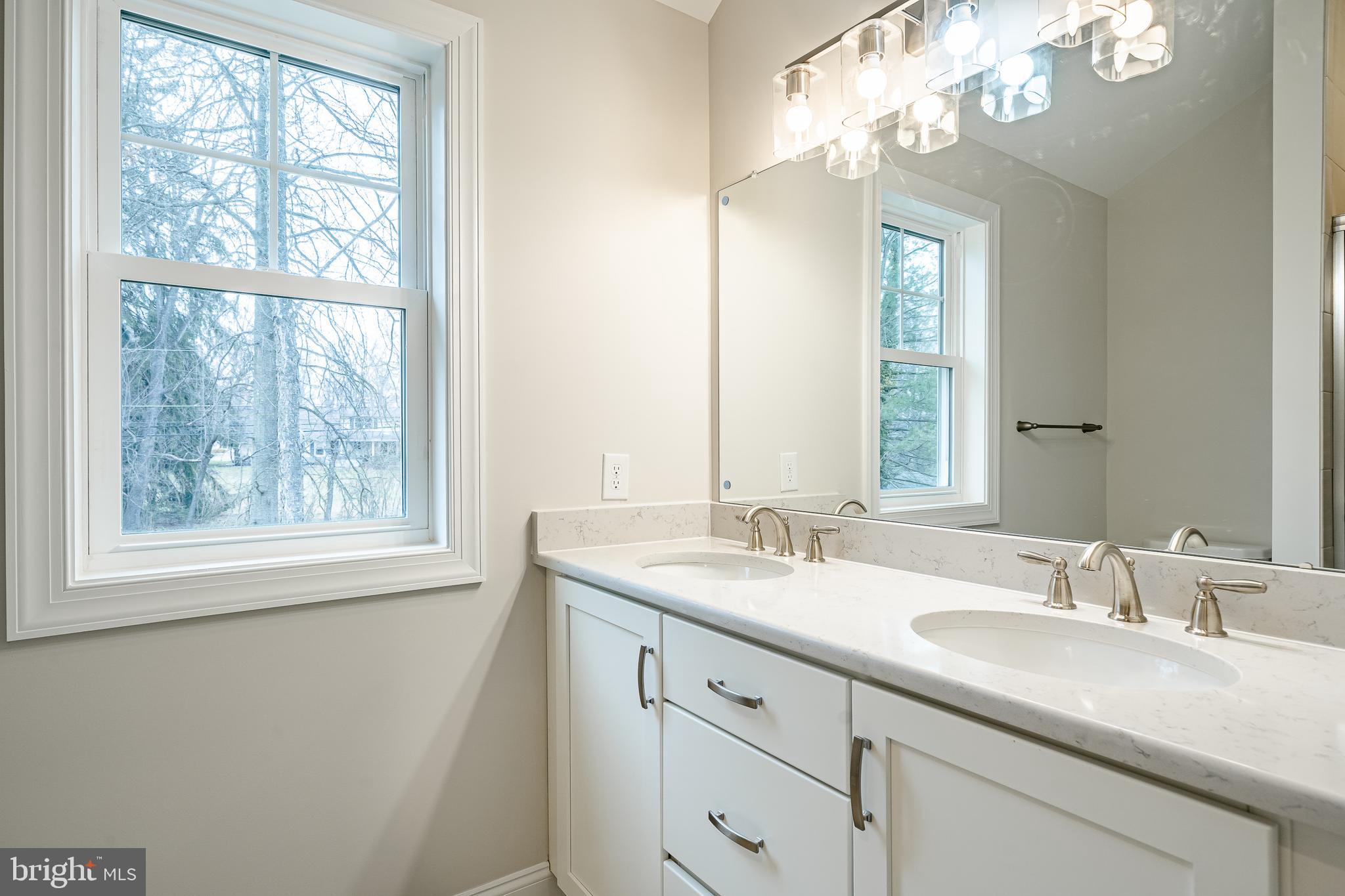 1107 Vilsmeier Road Lansdale, PA 19446 - Photo 47 of 58 a bathroom with a double vanity sink and a mirror