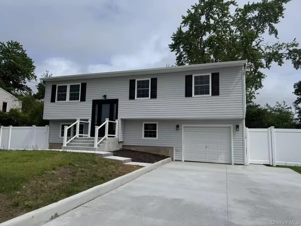 a front view of a house with garage