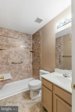 a room with pool table and windows